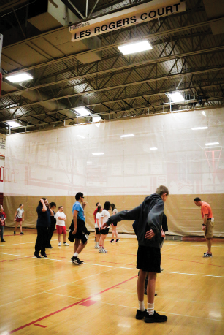 Life Skills P.E: Coach Crosby Tajan leads both life skills students and student athletes warm up together in the P.E. class