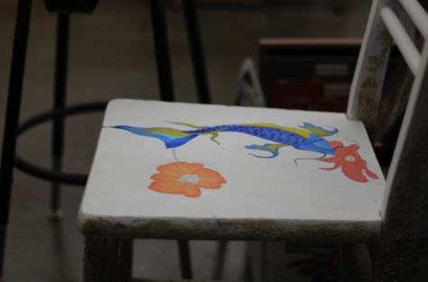 Brianna Jordan has been working on two chairs for the auction. The second of the two is featured here. She painted the seat and glued sand onto the legs of the chair.