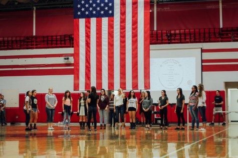 The girls' performing choir sang the National Anthem before the assembly.
