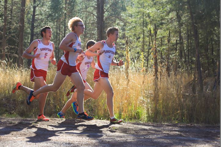 (Right to Left): Junior Reilly Wolfe, sophomore Cole Dillon, sophomore Peik Lund-Andersen, and senior Mark Kennaly ran as a group on the first lap.