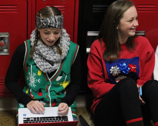 Students sport their ugly Christmas sweaters.
