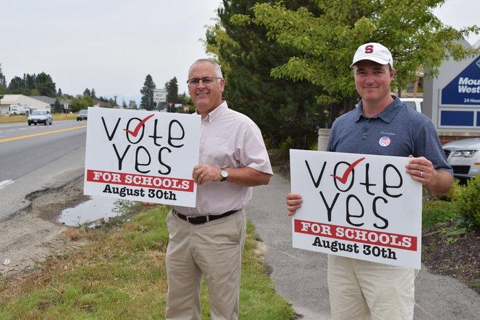 Principal Tom Albertson and Tom Bokowy rally for a positive vote on Tuesday.