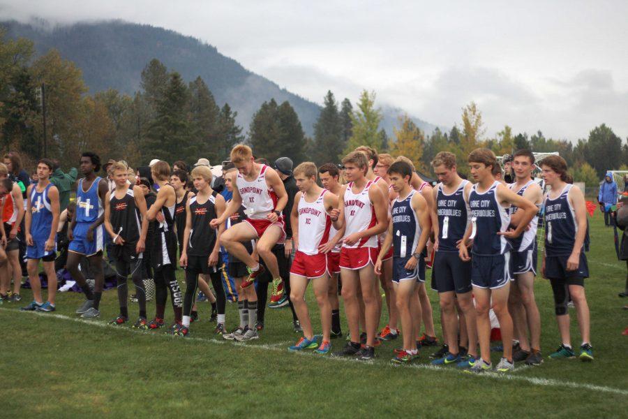 The boys varsity team line-up for the start of their 5K event. 
