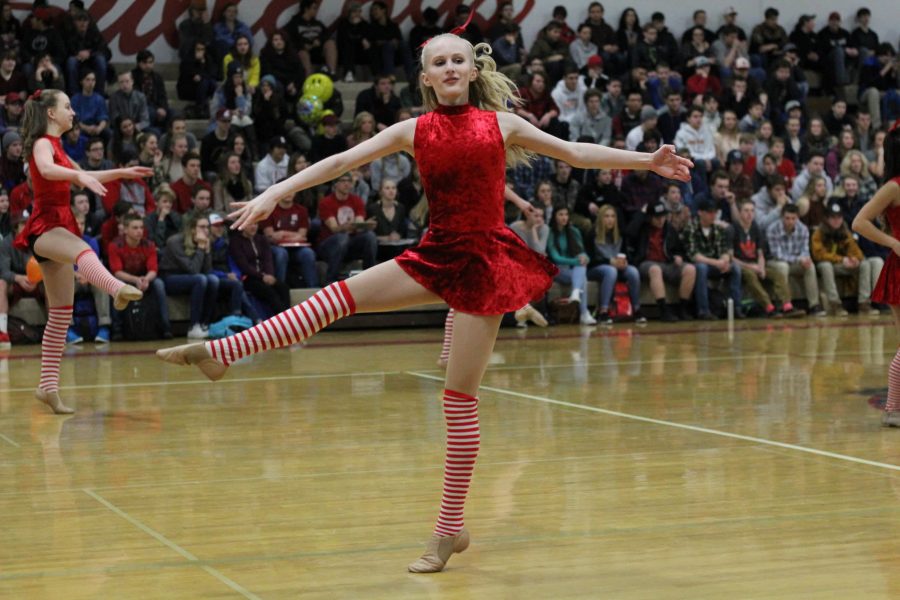 Senior Sara Liken-Savage does an a la seconde turn. Liken-Savage is currently co-captain of the dance team.
