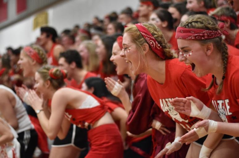 Sophomore Mikayla Schoening and Abigail Hendricks yell during the decibel reading. 