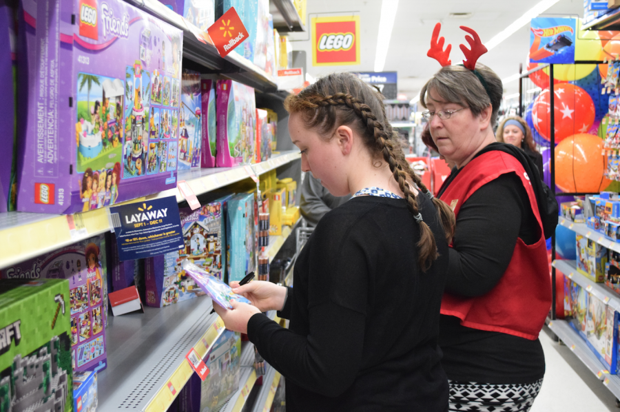 Students volunteer to help with the annual toy buy.