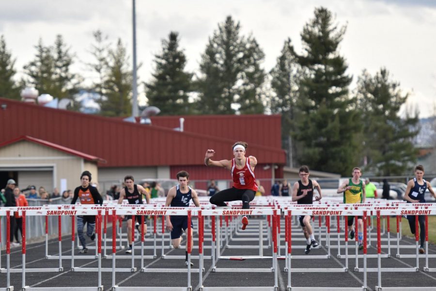 Senior TJ Davis clears a hurdle in the men’s 110 meter hurdles. Davis placed 1st in this event. 