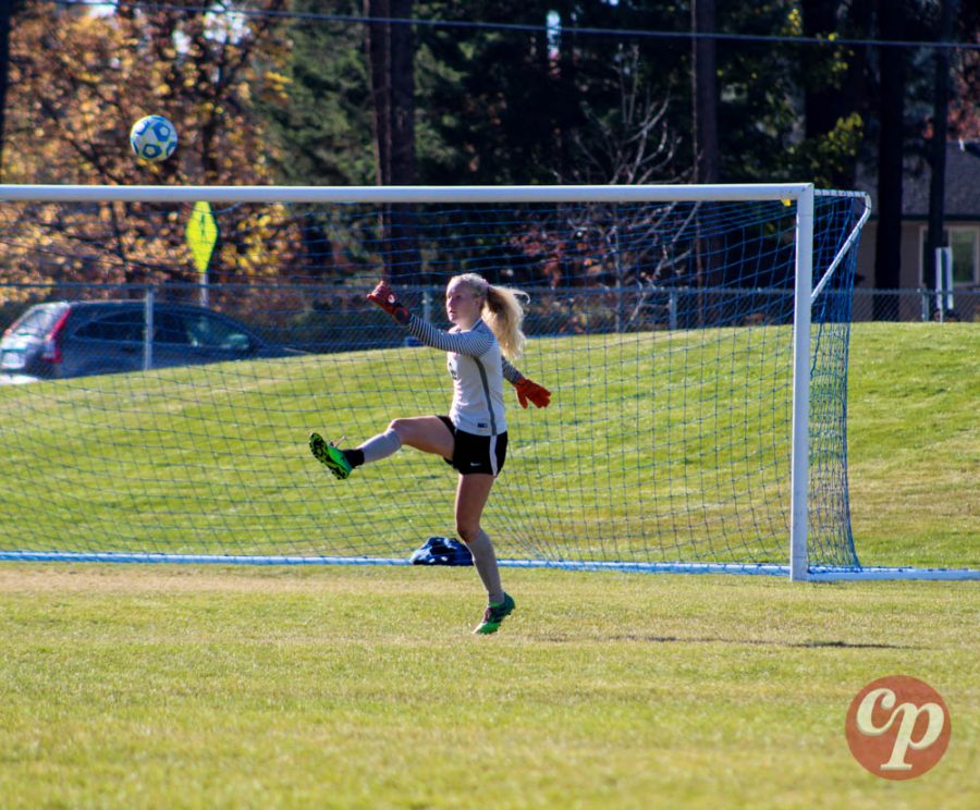 Sophomore Hattie Larson drop-kicks the ball downfield.