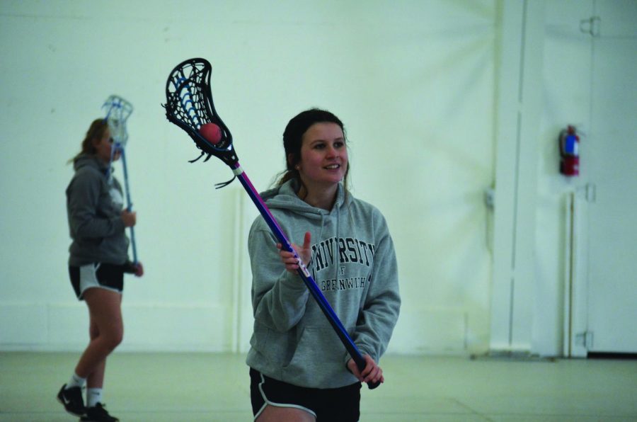 Sophomore starter Ellen Clark catches the ball in the pocket during her weekly lacrosse practice at the Bonner County Fairgrounds in Ponderay, Idaho.