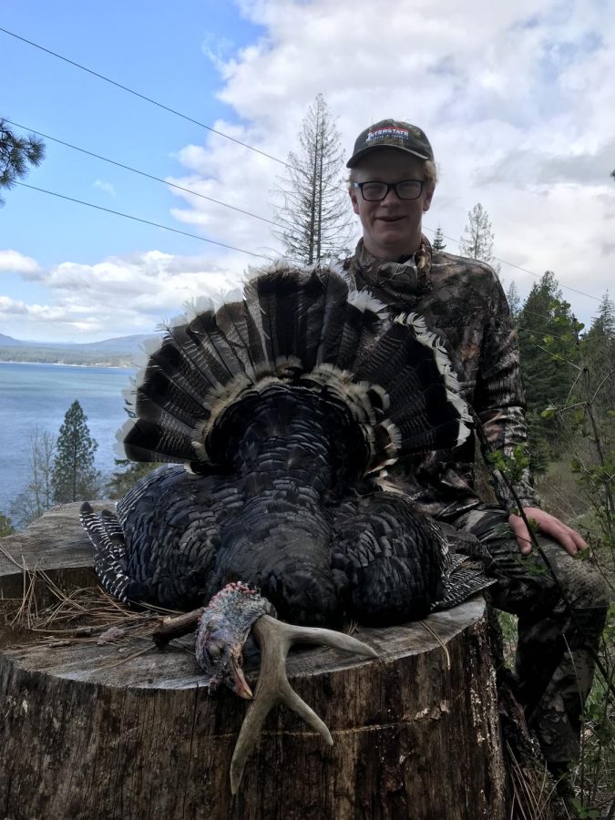 Sophomore Ethan Butler poses with a turkey he shot during the season.