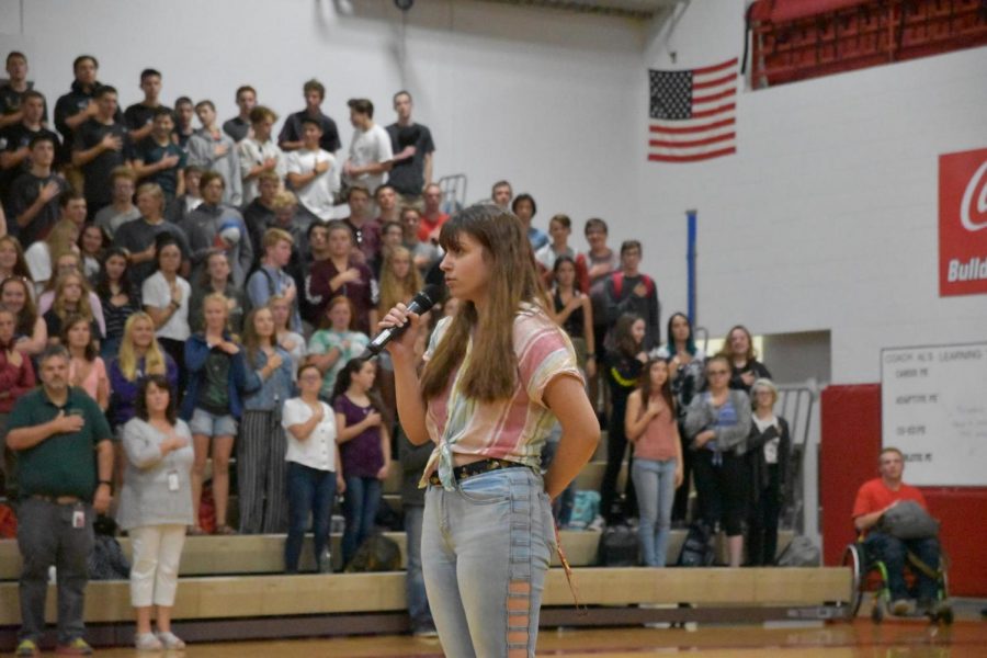 Senior+Jaida+Donaldson+sings+the+National+Anthem+for+the+first+day+of+school+assembly+in+front+of+over+one+thousand+students+and+faculty.