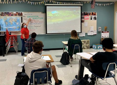 History teacher Mrs. Haynes wears a mask while teaching her students a condensed lesson.