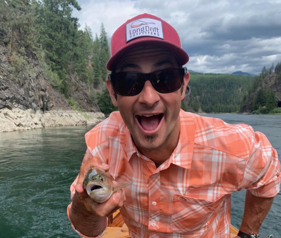 Band teacher Aaron Gordon holds a fish he caught on the Kootenai River.
