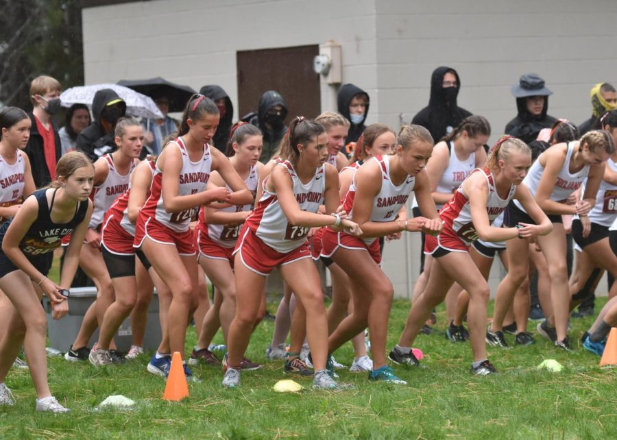 The girls team lines up and gets ready for the start their home meet race.