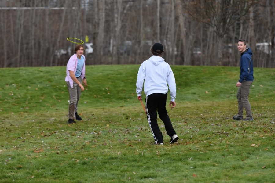 Kylan Blaser, Hayden Norling, and John Keegan engage in their daily game of frisbee. 